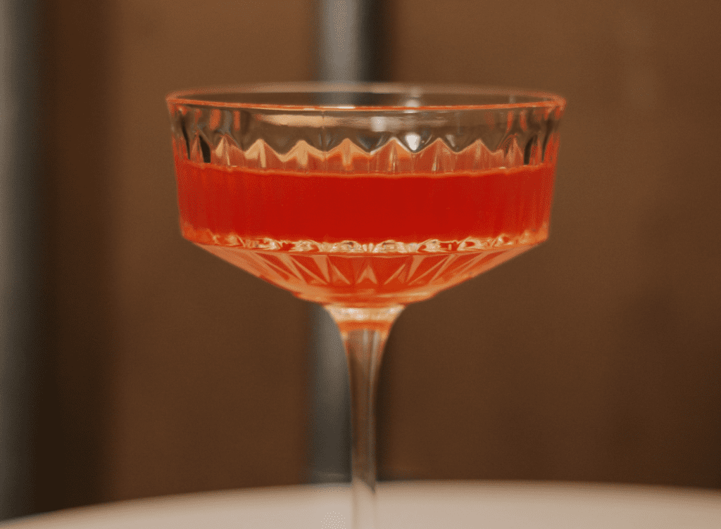 A glass of red liqueur 